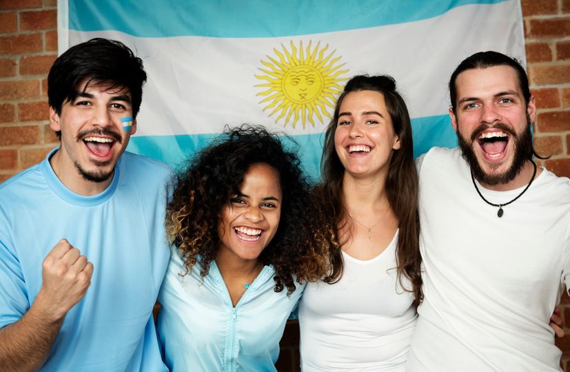 Friends cheering world cup with painted flag