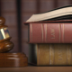 Justice, law and legal concept. Judge gavel and law books. 3d illustration