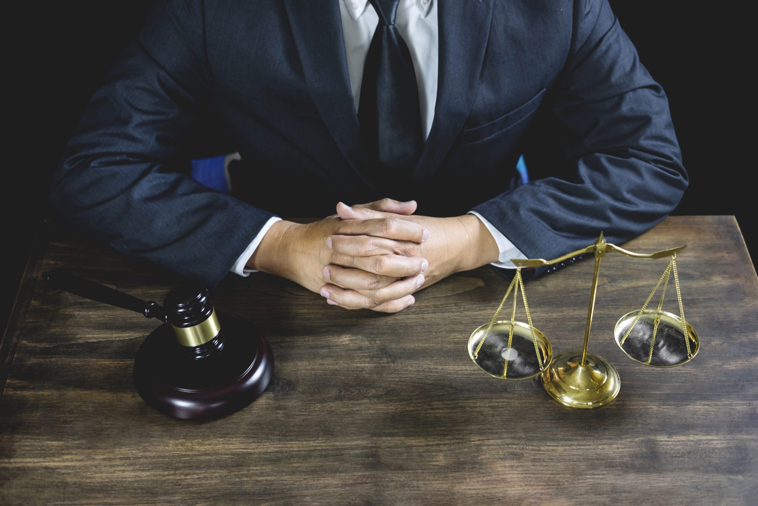 Legal law, Judge gavel with Justice lawyers advice with gavel and Scales of justice, Counselor or Male lawyer working on courtroom sitting at the table and papers.