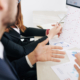 Business colleagues discussing growing line chart at meeting when working on investment research analysis