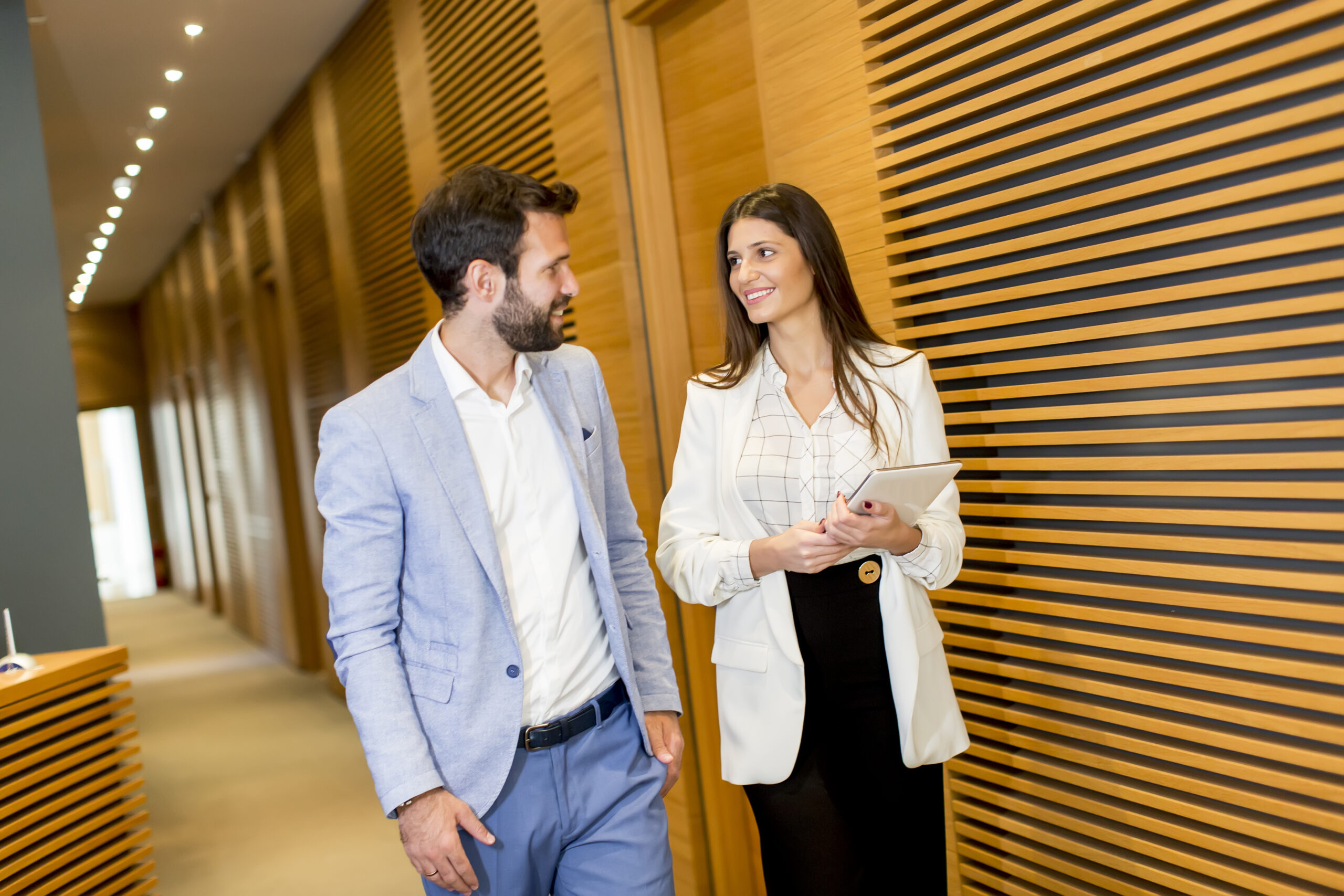 Business couple with tablet in the office