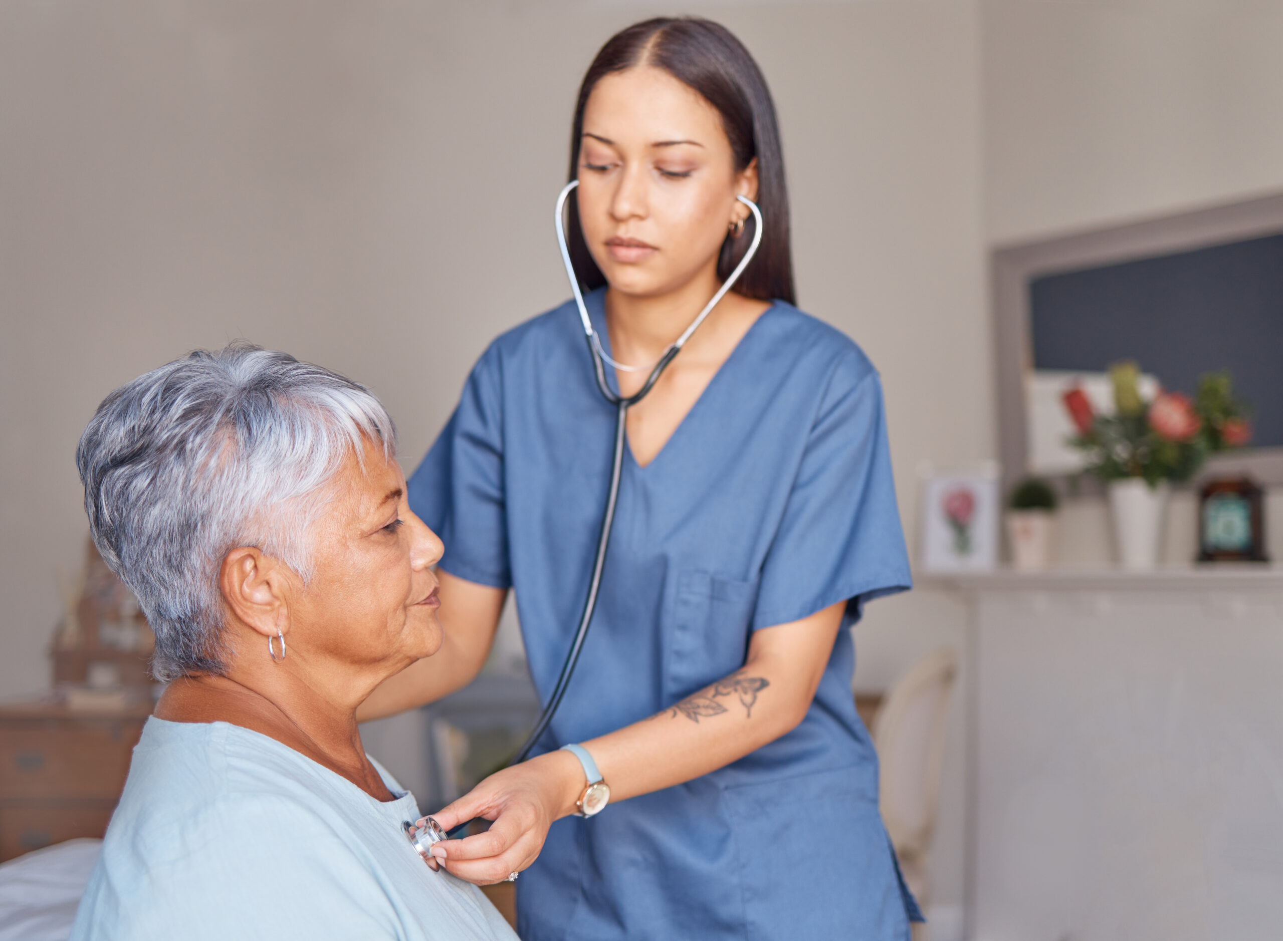 Elderly patient, nursing and nurse with a stethoscope listening to heartbeat during a health consul.