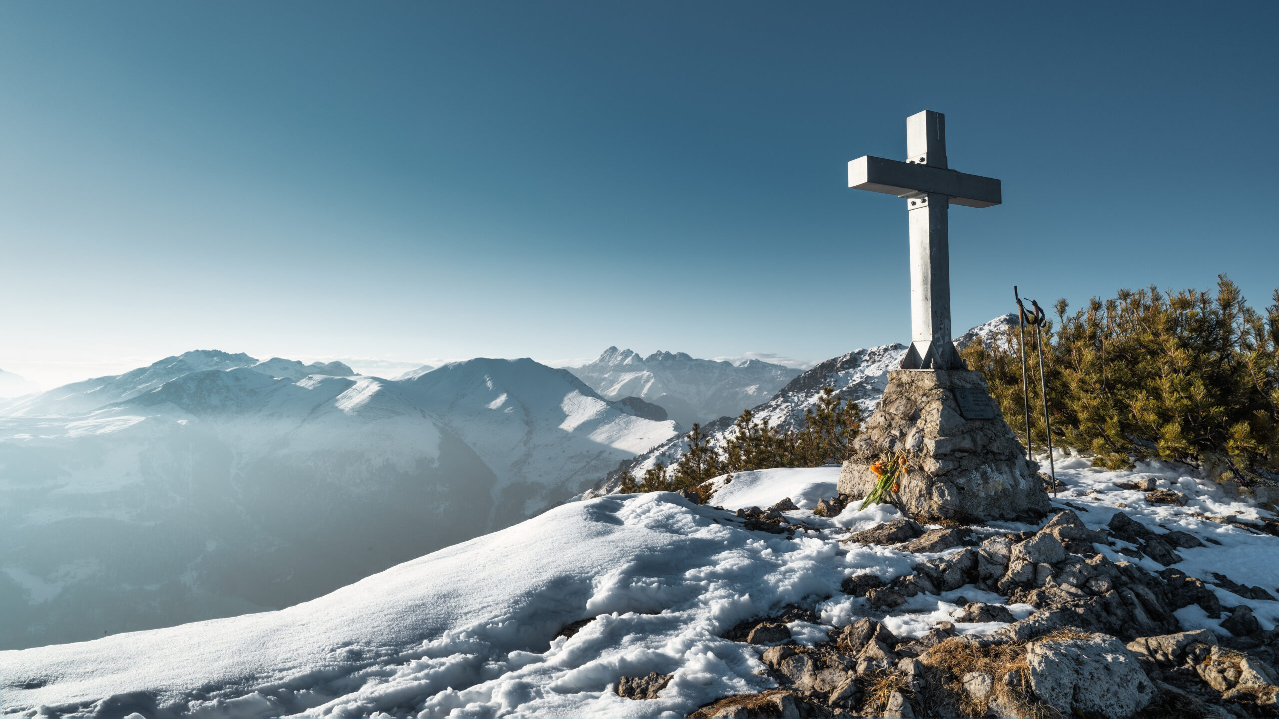 The cross on top of a mountain in the Italian Alps