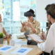 Businessman wearing virtual reality headset at business meeting. Teamwork, startup, innovation concept.