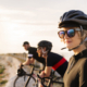 Three cyclists looking at view