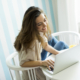 Woman with a laptop and orange juice