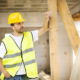 Construction worker is working on new house