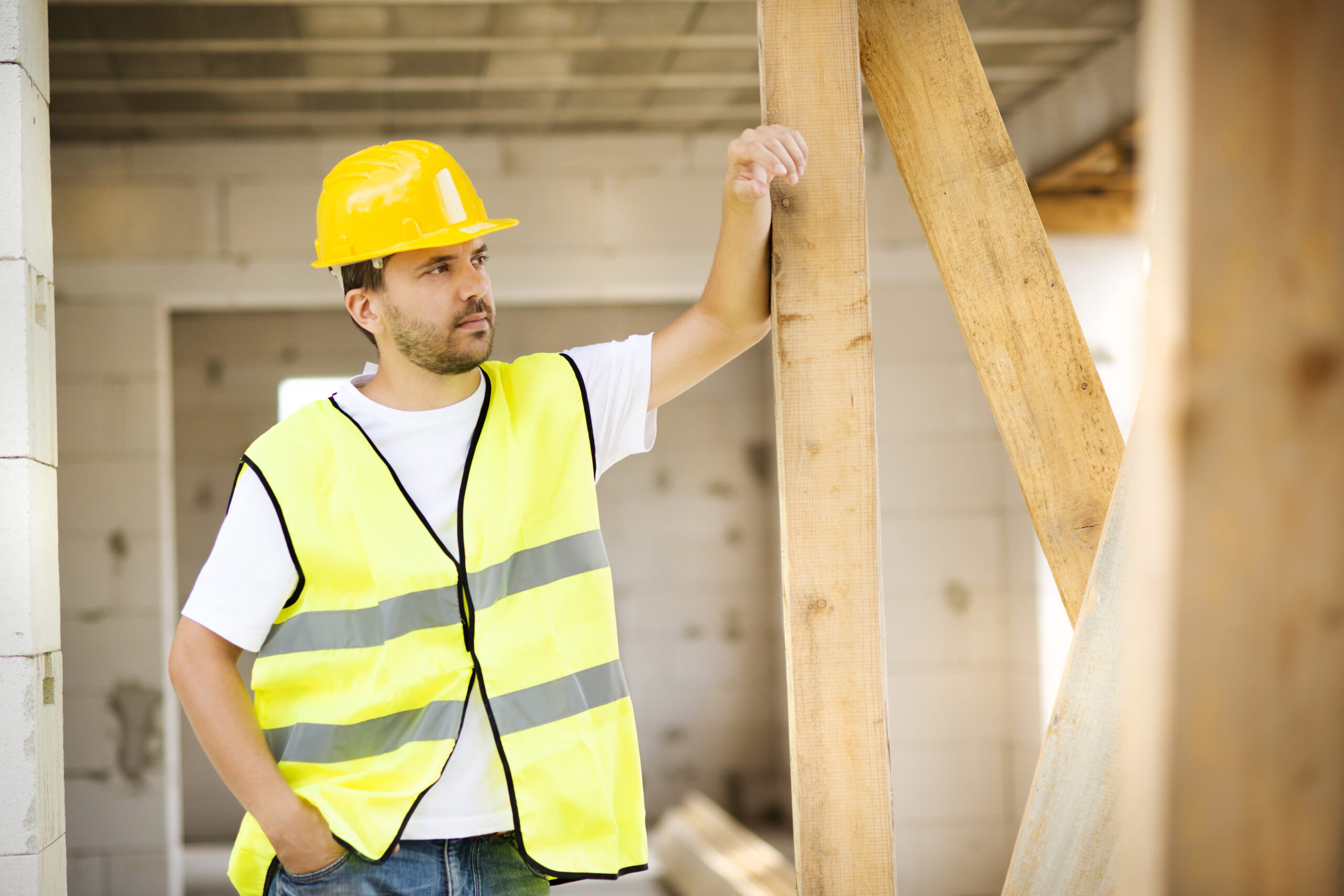 Construction worker is working on new house