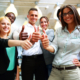 Happy business group giving thumbs up