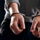 Offender with his hands in handcuffs