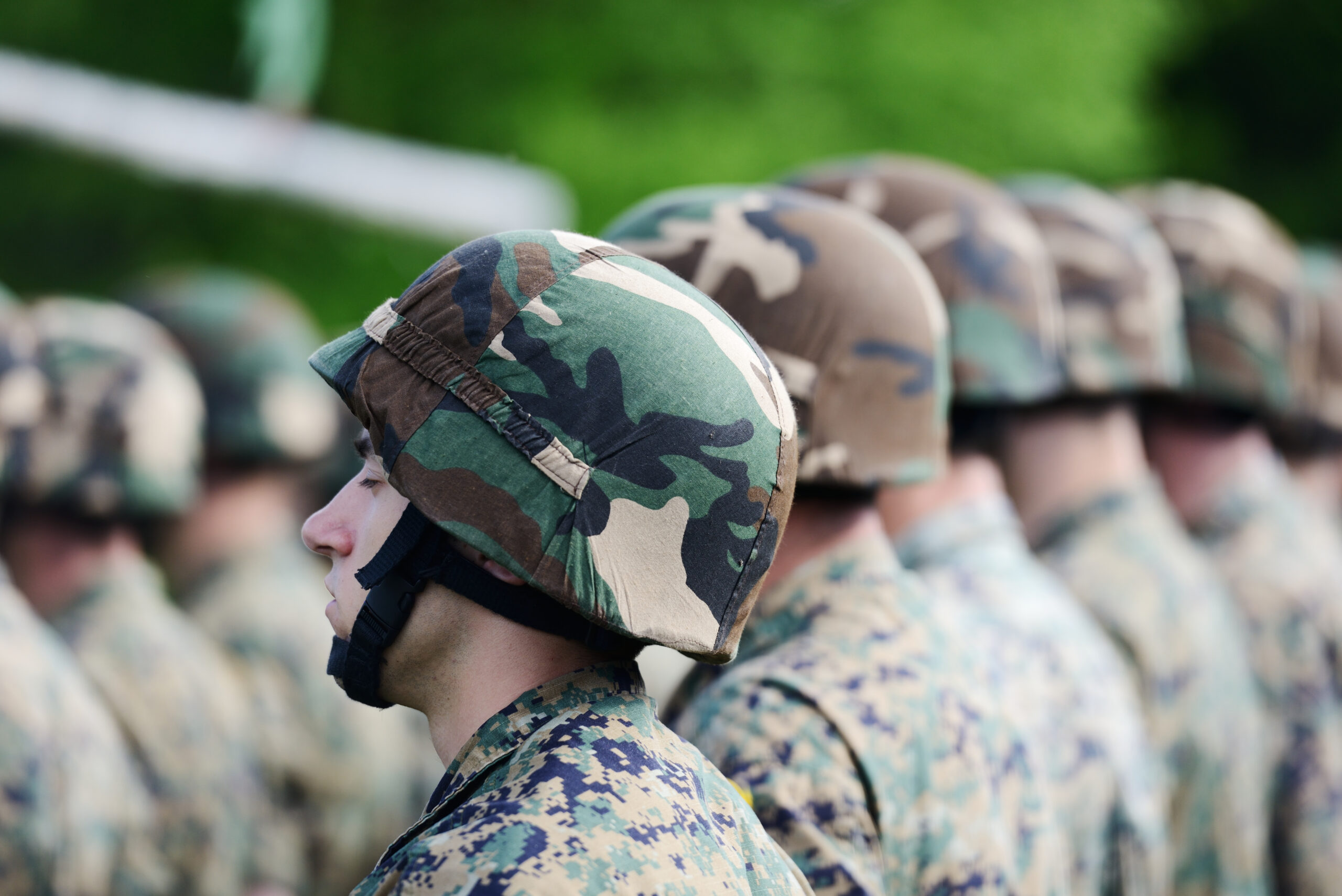 Soldiers with military camouflage uniform in army formation