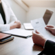 Job applicants are holding a resume document in the job interview room, job interview concept.